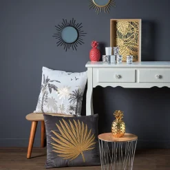 Coussin blanc motif paysage tropical noir et doré