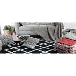 Coussin imprimé avec pompons