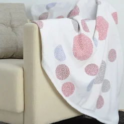 Jeté de canapé blanc design pois