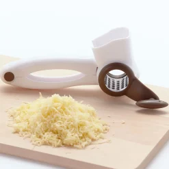 Râpe à fromage blanche et taupe